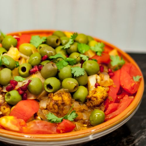 Moroccan chicken tagine cooked and garnished
