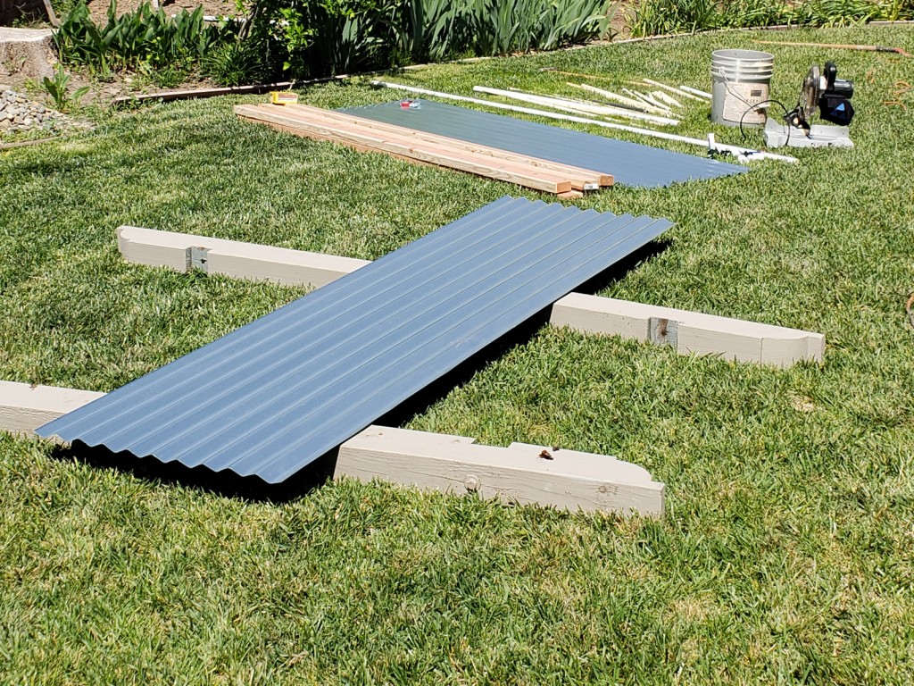 Preparing to cut each corrugated metal panel