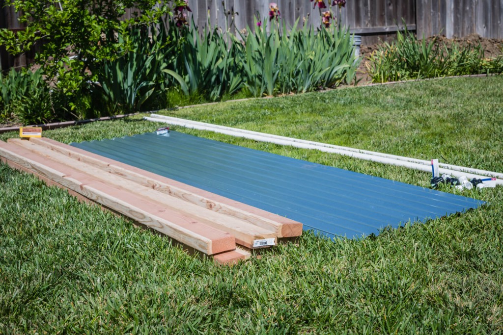 Laying out the supplies for the metal raised garden beds