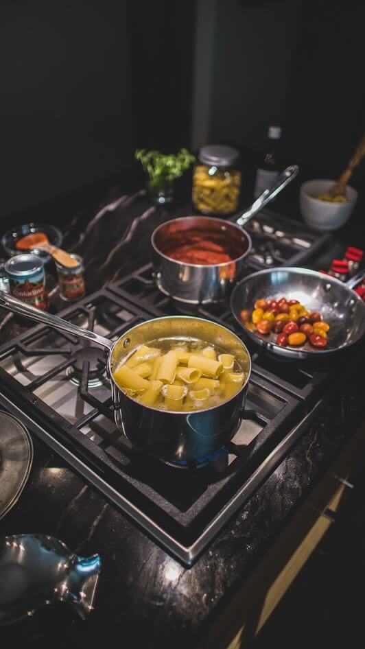 Paccheri pasta on the stove.