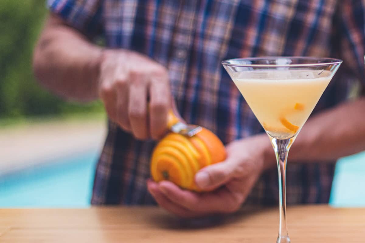 Peeling orange for garnish