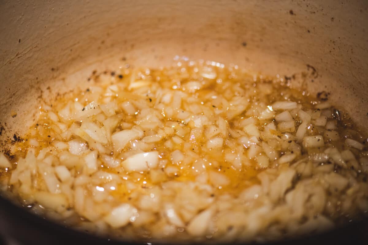 Add onions to casserole and cook until soft.