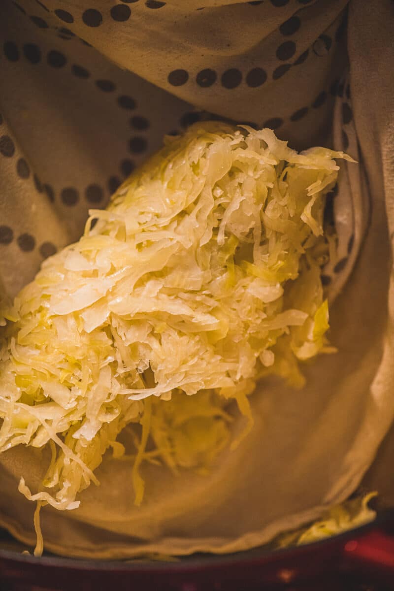 Add sauerkraut and apples, reduce heat to low, and cook for about 45 minutes or apples are tender. Add sauerkraut and apples, reduce heat to low, and cook for about 45 minutes or apples are tender.
