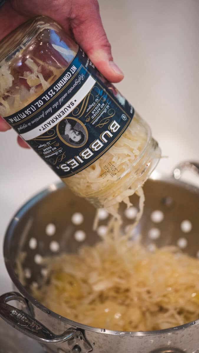 Drain sauerkraut, rinse, and squeeze dry.