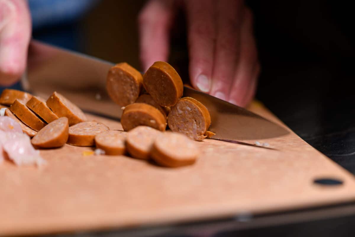 Cajun sausage and chicken jambalaya slicing sausage