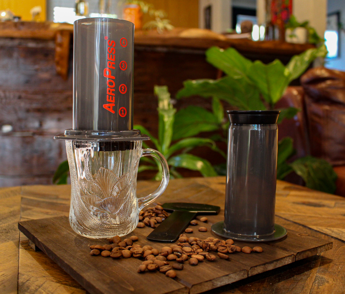 Aeropress coffee maker with coffee beans