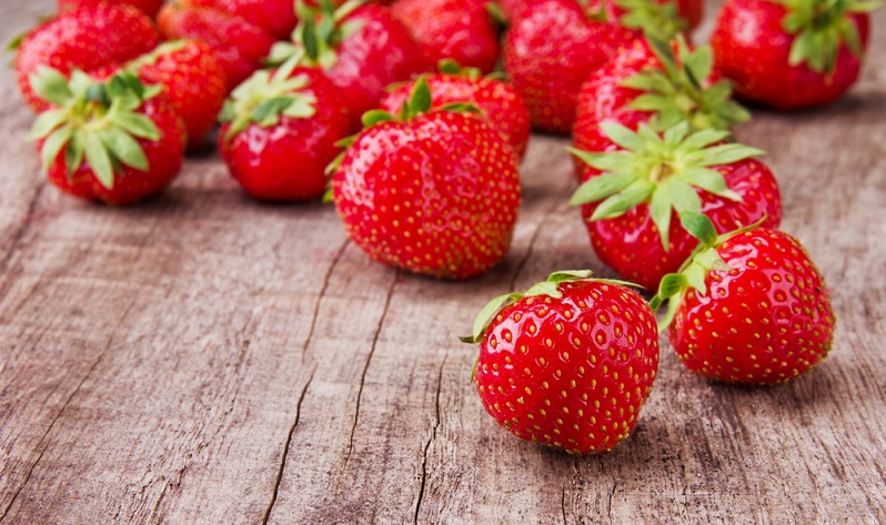 Revitalizing mango-berry protein smoothie strawberries