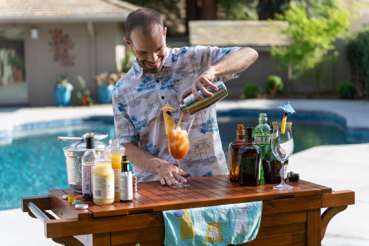 Singapore sling pouring cocktail