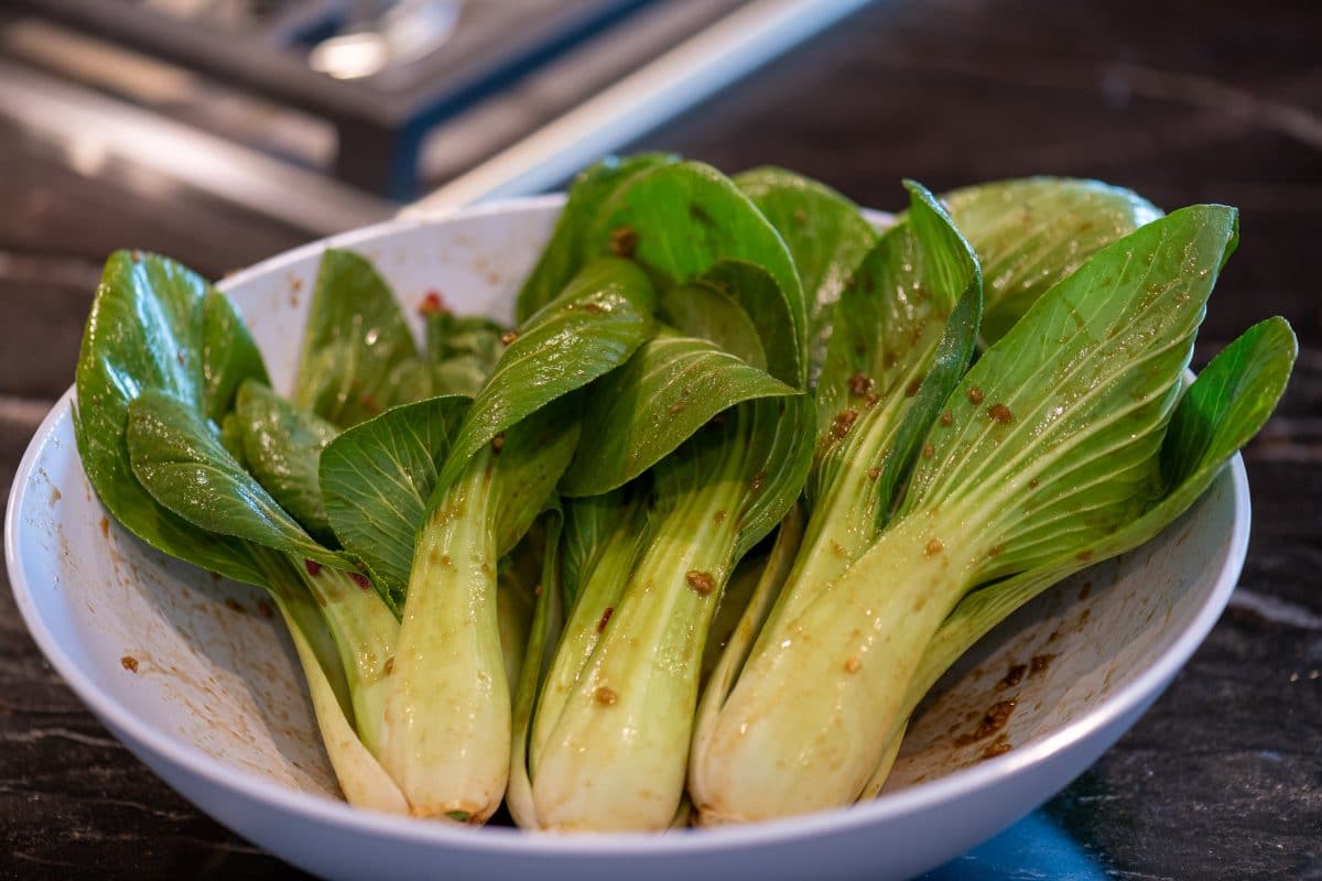 Bok choy coated with marinade