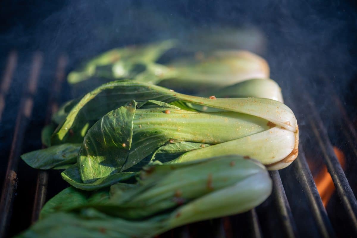 Bok choy cooking on grill