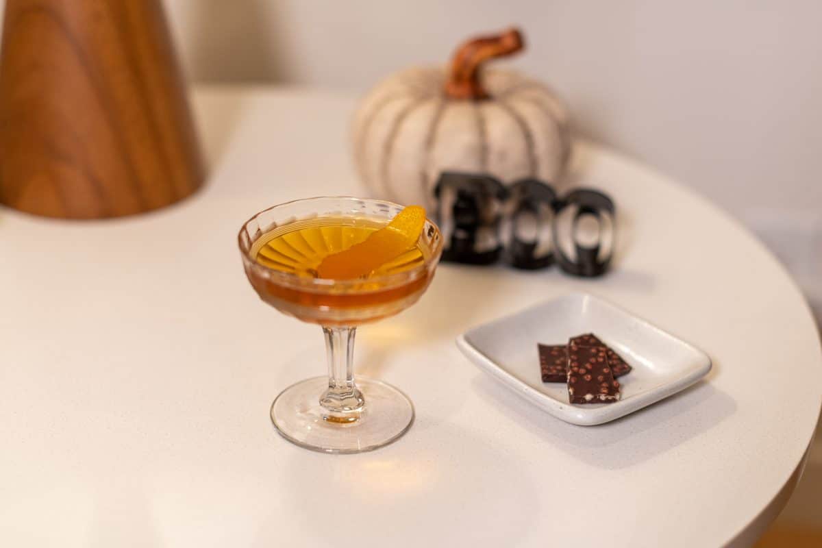 Batched orange manhattan cocktail