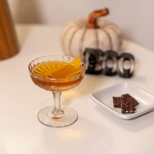 Batched orange manhattan cocktail