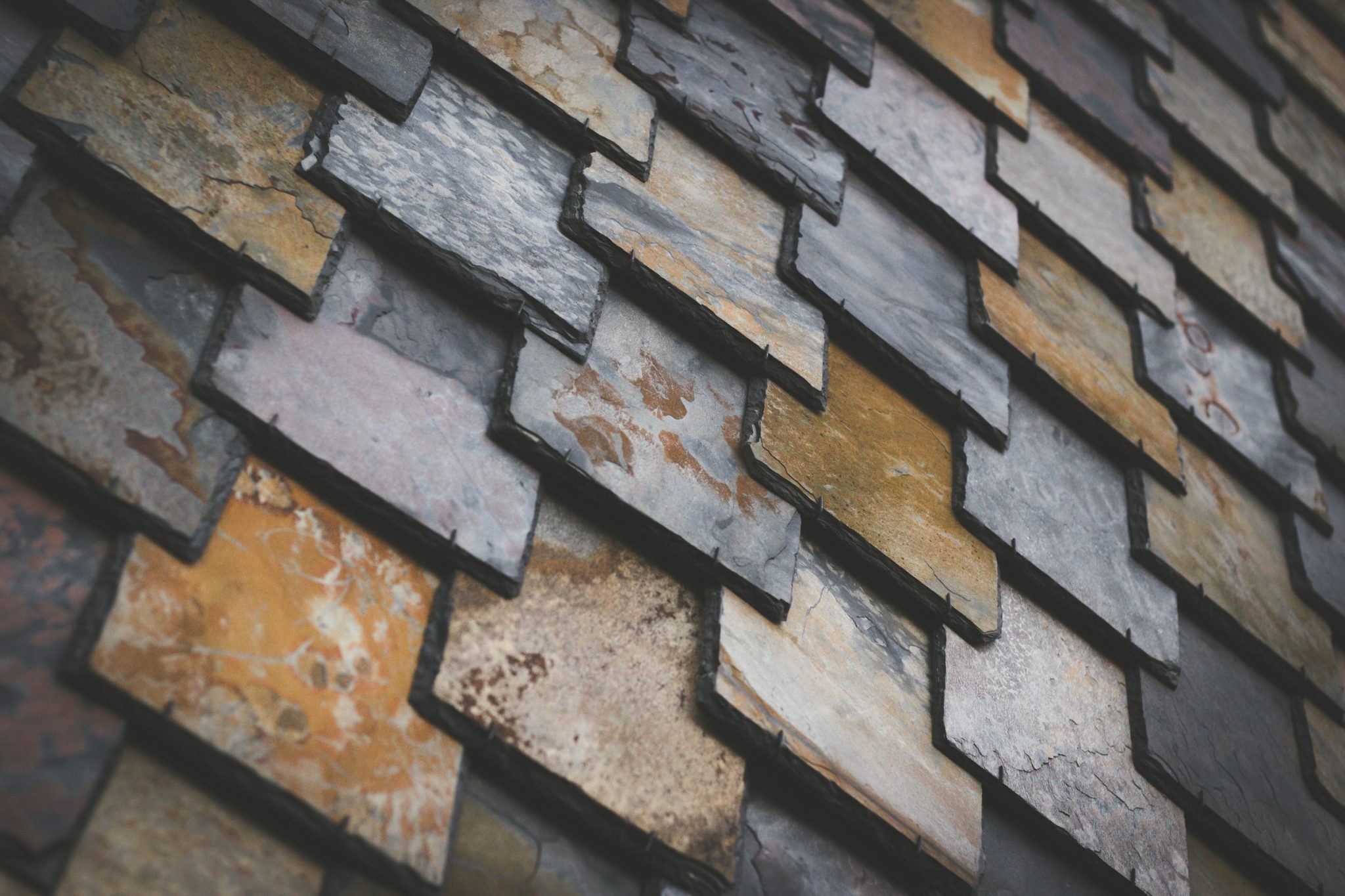 The timeless patina of slate roofs reflects the intentionality of builders who value enduring design
