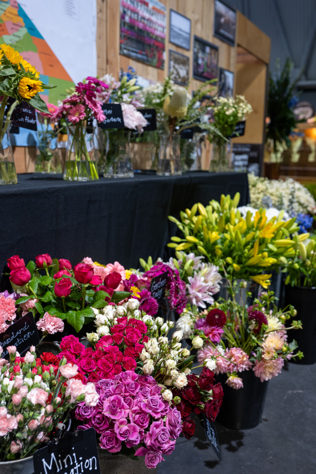 Buckets of fresh cut roses and lilies at the california state fair floral shop