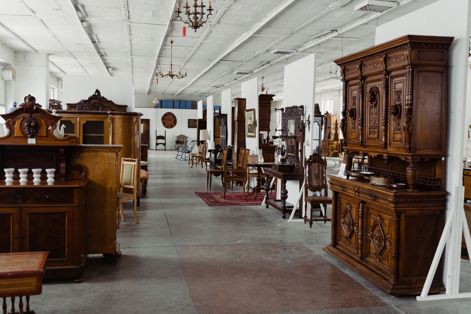 A showroom of antique wooden furniture on display in a sacramento shop