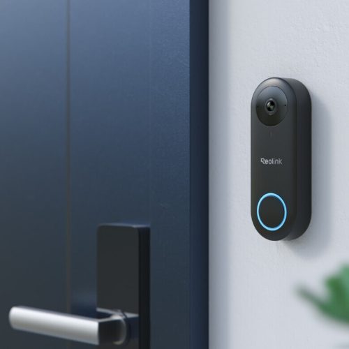 Reolink video doorbell wifi mounted on a wall beside a dark blue front door