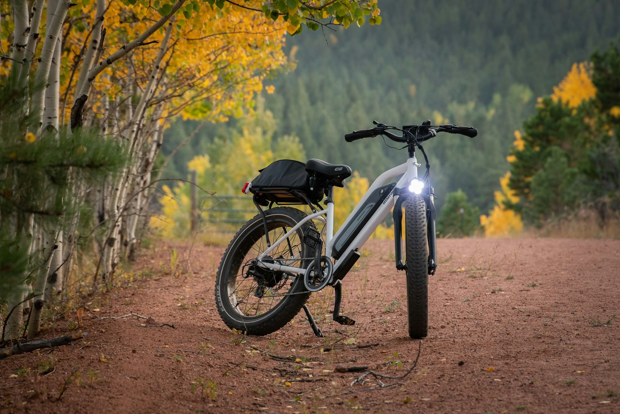 How should hunters choose an e-bike for sand, gravel, and rocky access roads?