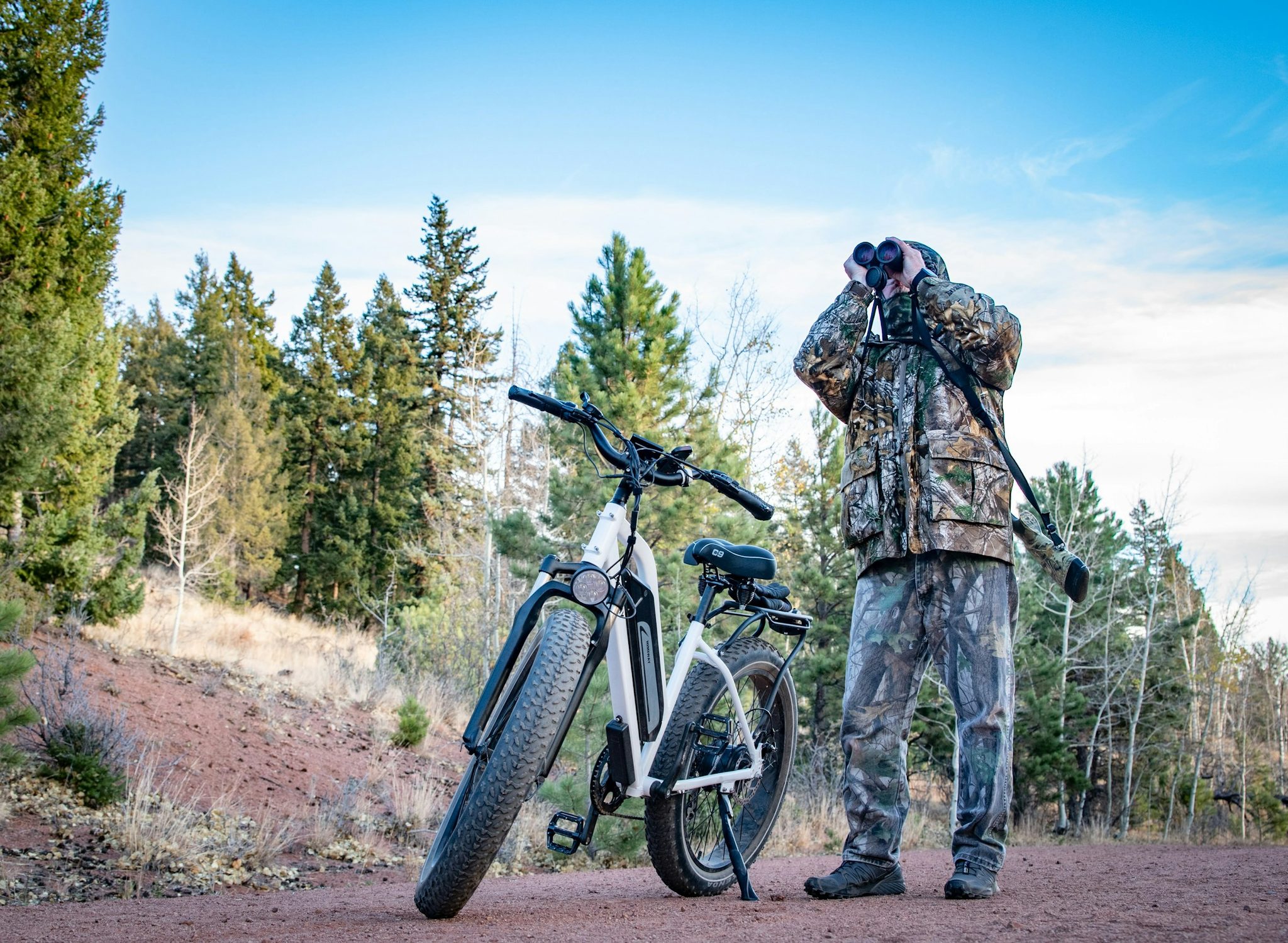 How should hunters choose an e-bike for sand, gravel, and rocky access roads?