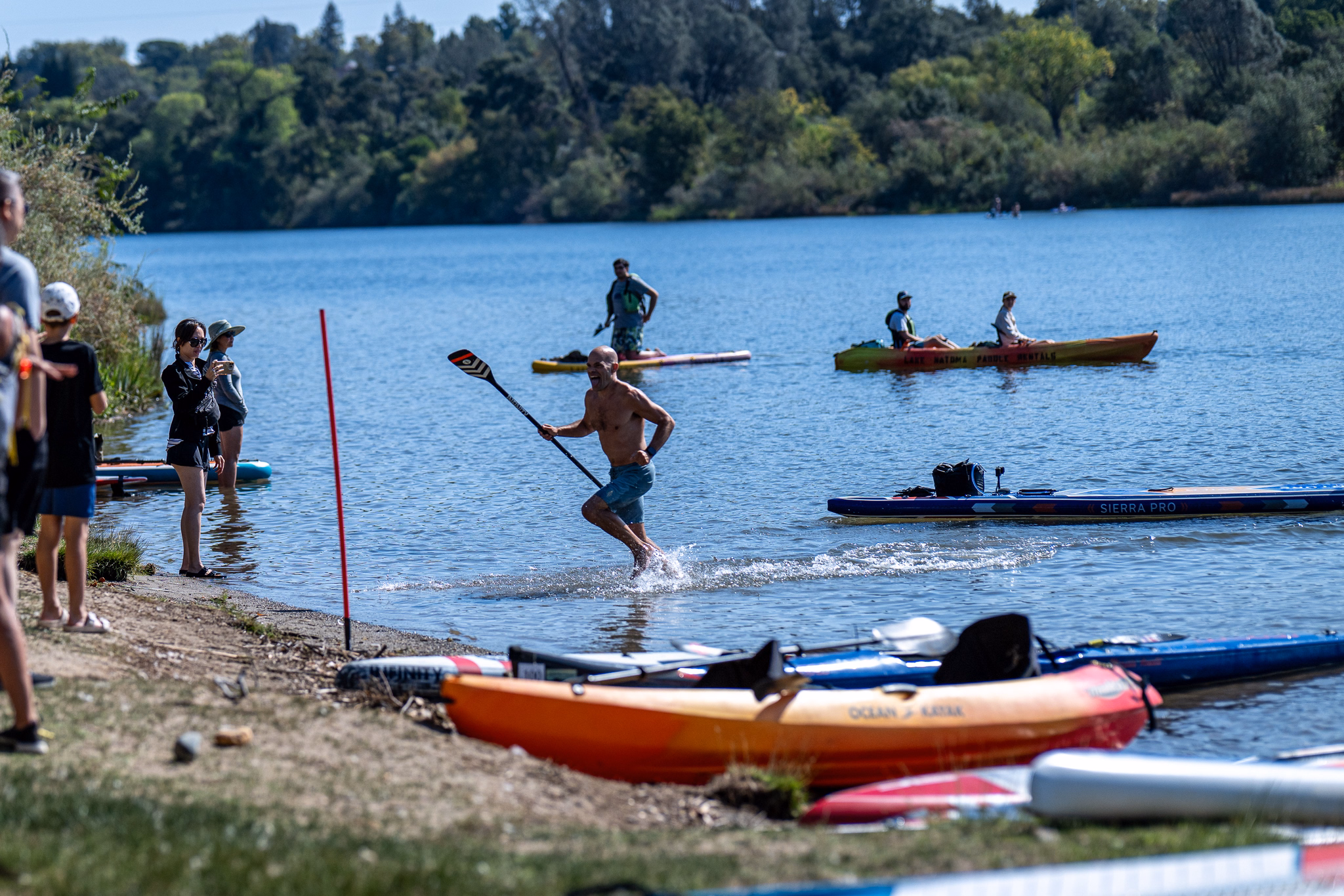2026 paddlesplash festival at lake natoma: races, relays, festivities, and taking home gold 28 the schedule travels. The single most useful thing i did at paddlesplash was settle in advance what went in and when, rather than deciding it on the day. Nationals spreads the big three across three days rather than three hours, which makes the planning easier and the discipline harder. Paddler running off the sandy beach into the shallows to launch a race board
