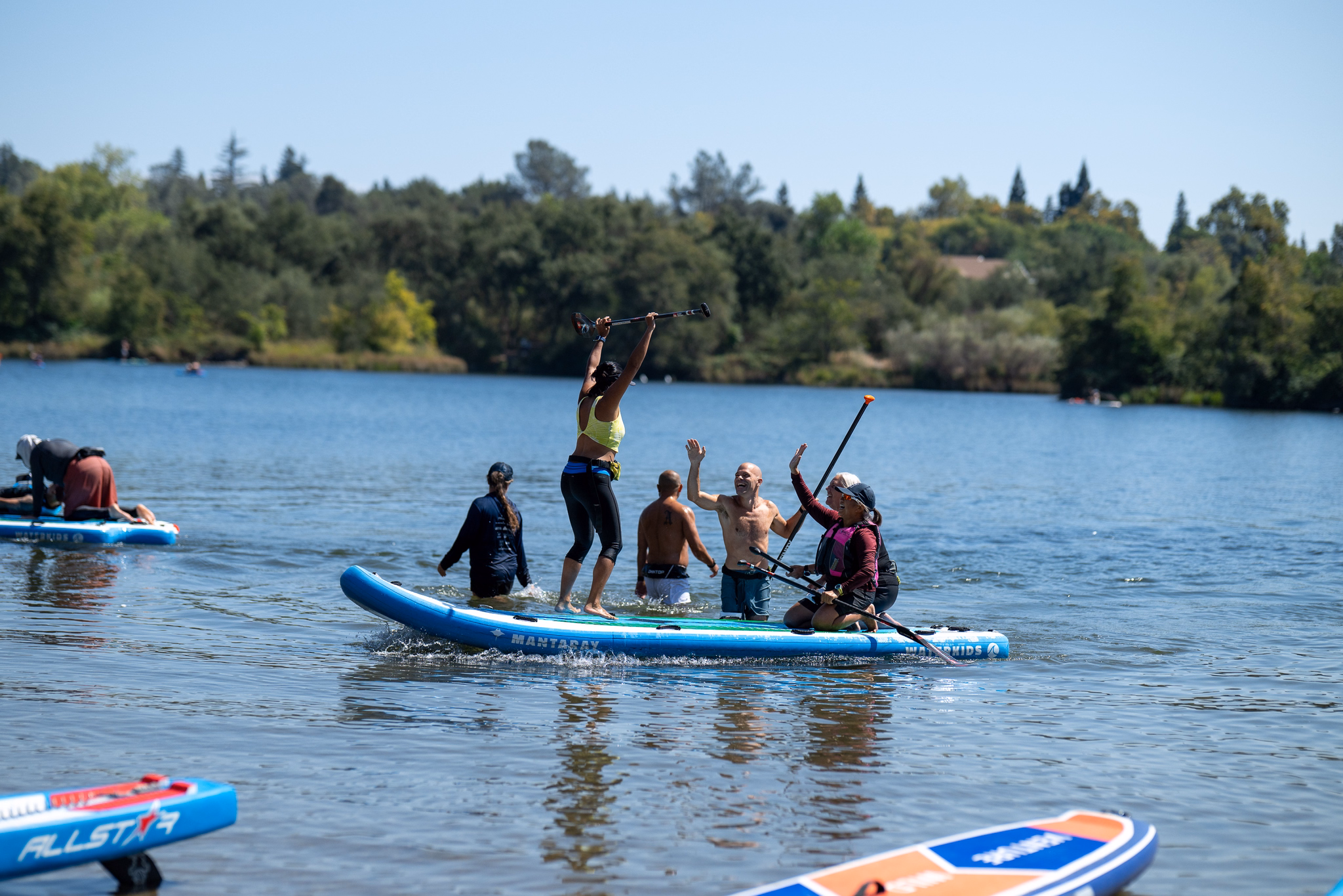 2026 paddlesplash festival at lake natoma: races, relays, festivities, and taking home gold 13 the schedule travels. The single most useful thing i did at paddlesplash was settle in advance what went in and when, rather than deciding it on the day. Nationals spreads the big three across three days rather than three hours, which makes the planning easier and the discipline harder. Relay team of paddlers celebrating on the water with paddles raised at the finish of the four person relay