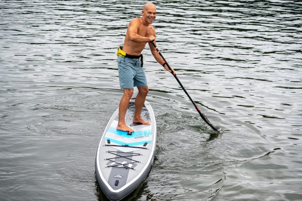 Michael kahn warming up on a hydrus elysium air inflatable race board in gig harbor before the sprints at the 2026 usa sup national championships