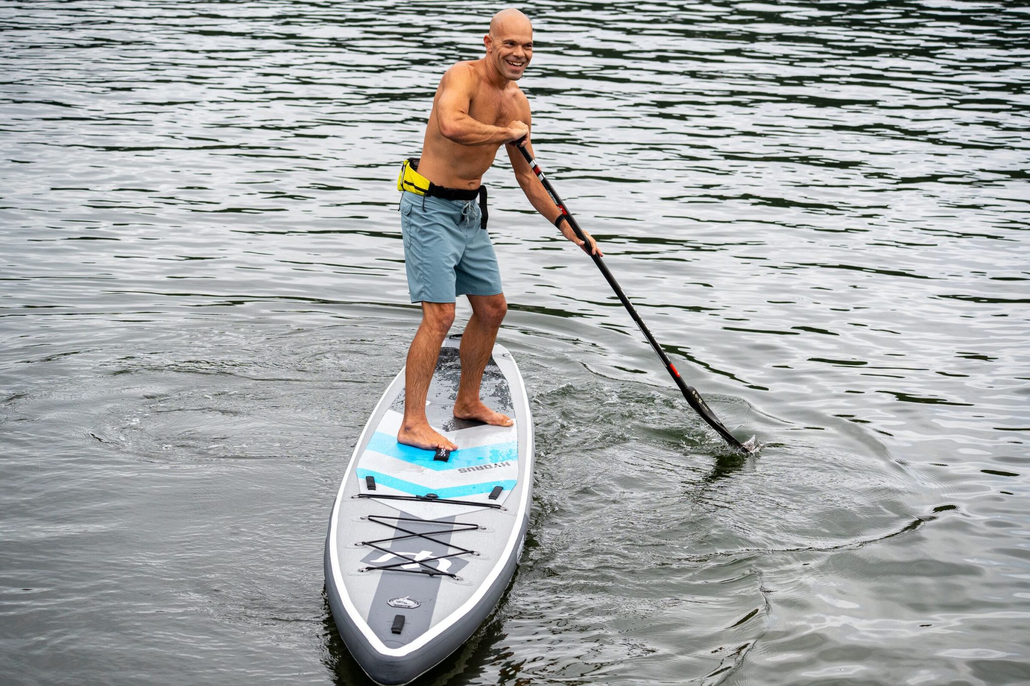 Michael kahn warming up on a hydrus elysium air inflatable race board in gig harbor before the sprints at the 2026 usa sup national championships