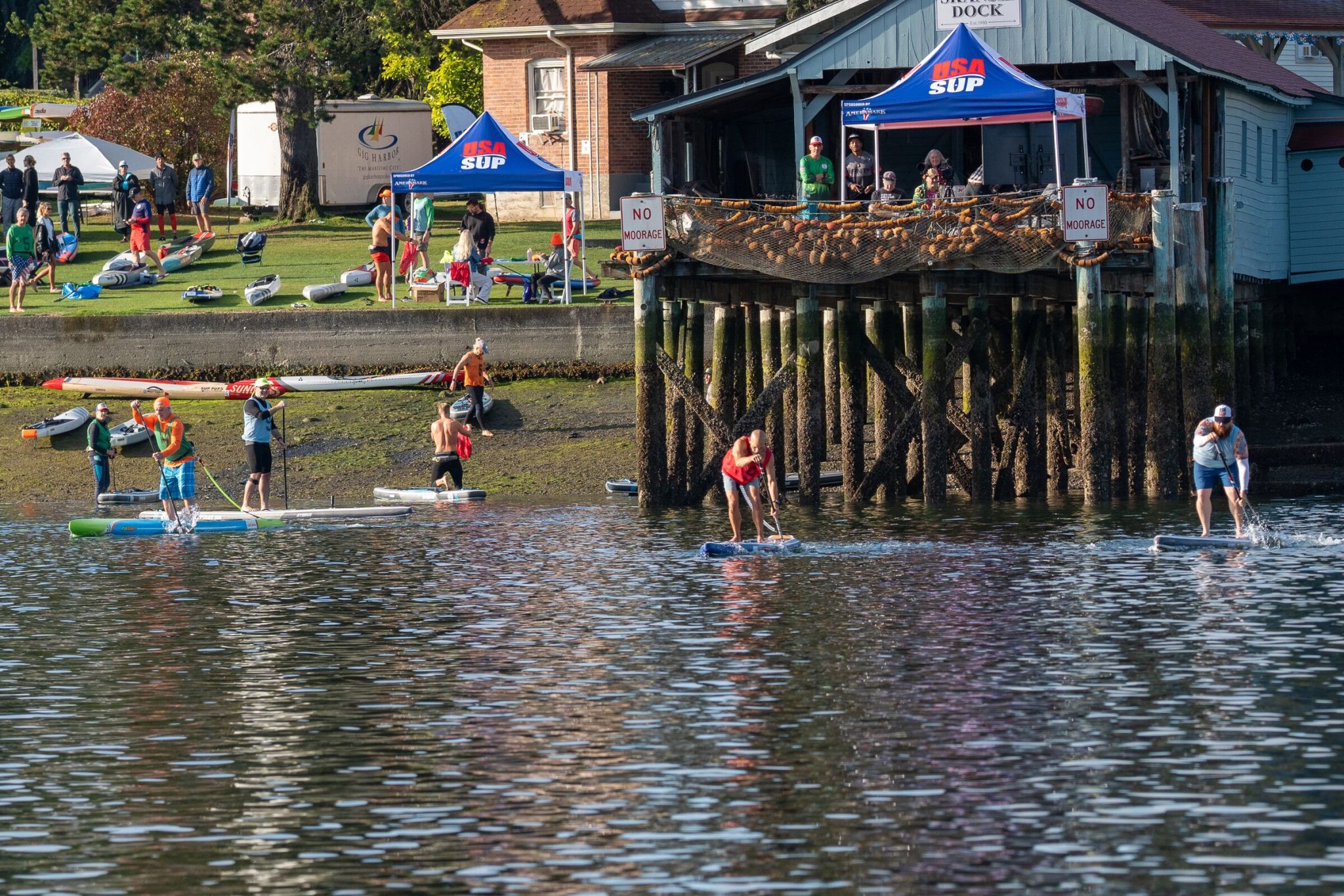 Usa sup nationals 2026: gig harbor and the first inflatable division 14 everything i could verify about the 2026 usa sup national championships in gig harbor, plus the 35-day training block behind my entry in the new inflatable division. Paddlers on inflatable race boards leaving the shore at skansie brothers park past the net shed dock, with usa sup tents on the lawn behind